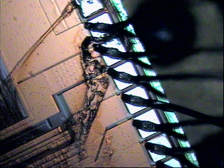 Close-up of discolored area near wire bonds