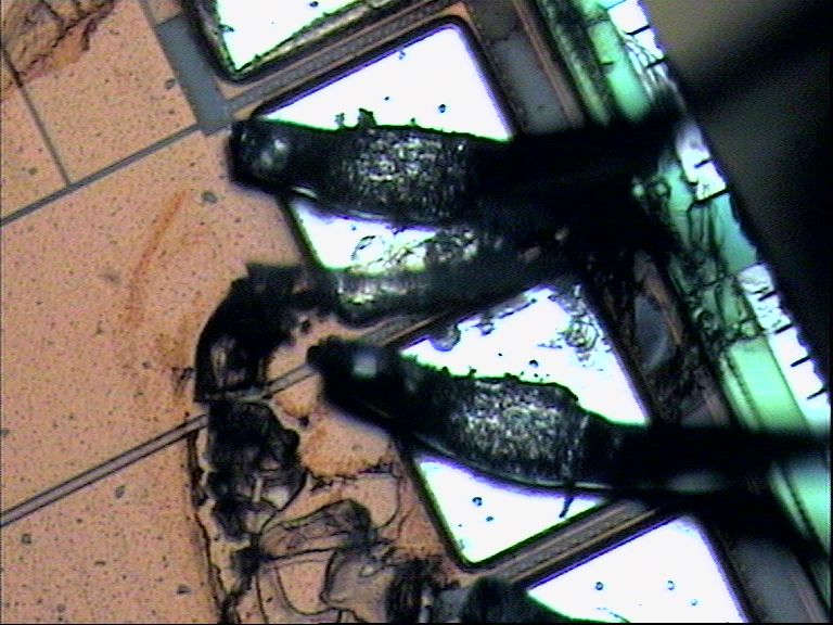 Closer-up of discolored area near wire bonds